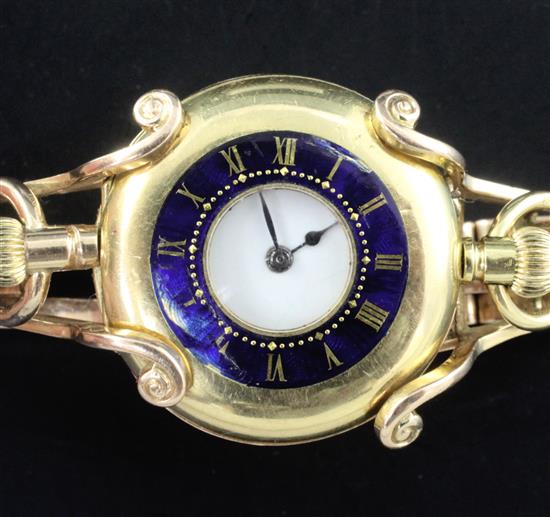 An early 20th century 18ct gold half hunter fob watch with a 15ct gold bracelet,